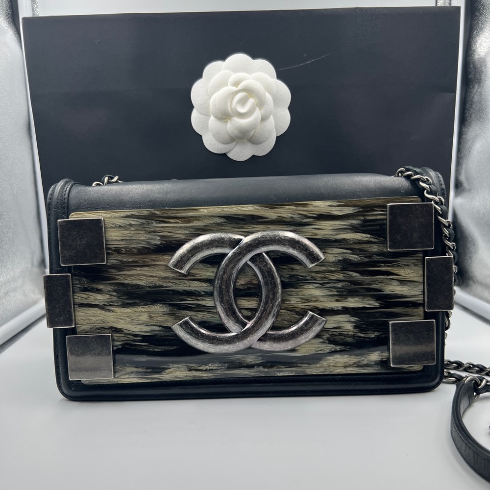 Authentic Chanel Black Plexiglass Iridescent
Leather E/West Boy Brick Flap Bag